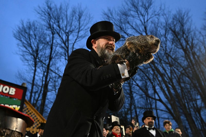Groundhog Club handler A.J. Dereume holds Punxsutawney Phil, the weather prognosticating groundhog, during the 138th celebration of Groundhog Day on Gobbler's Knob in Punxsutawney, Pa., Friday, Feb. 2, 2024