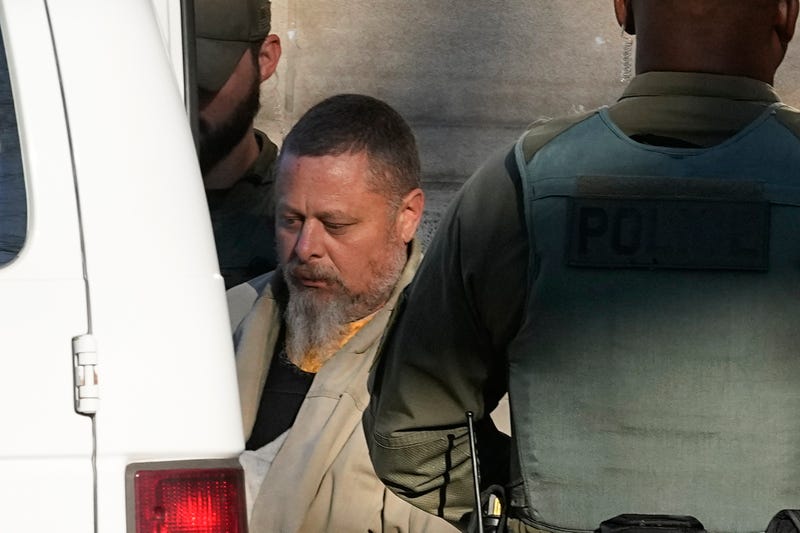 Officers escort Richard Allen out of the Carroll County courthouse following a hearing, Nov. 22, 2022, in Delphi, Ind. On Monday, March 11, 2024, a judge moved up the trial date for Allen, an Indiana man charged in the 2017 slayings of two teenager girls. Allen's jury trial is now scheduled for May 13 through May 31, according to court records.