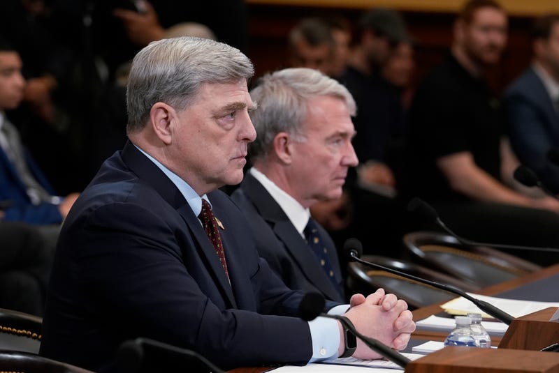 Retired Gen. Mark Milley, left, the former chairman of the Joint Chiefs of Staff, left, and retired Gen. Kenneth McKenzie, former commander of the U.S. Central Command, speak to the House Foreign Affairs Committee about the U.S. withdrawal from Afghanistan, at the Capitol in Washington, Tuesday, March 19, 2024.