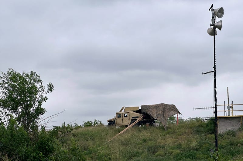 Members of the National Guard patrol a road near a federal border wall on Tuesday, March 19, 2024, in Hidalgo, Texas.