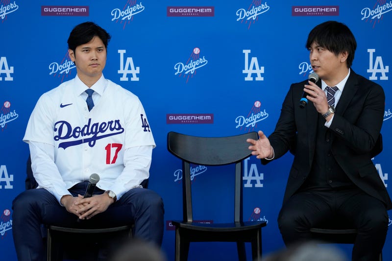 FILE - Los Angeles Dodgers' Shohei Ohtani, left, and interpreter Ippei Mizuhara answer questions during a news conference at Dodger Stadium on Dec. 14, 2023, in Los Angeles. Mizuhara has been fired from the Dodgers following allegations of illegal gambling and theft.
