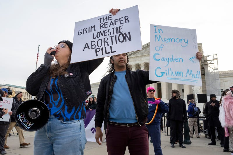 Anti-abortion protestors rally outside the Supreme Court.
