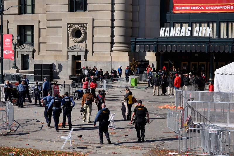 Law enforcement personnel approach Union Station following a shooting at the Kansas City Chiefs NFL football Super Bowl celebration