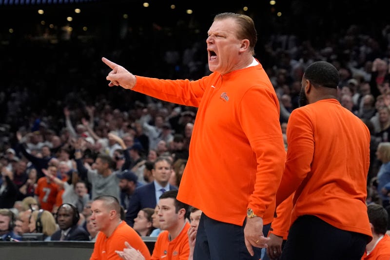 Illinois head coach Brad Underwood calls to officials during the first half of the Elite 8 college basketball game against UConn in the men's NCAA Tournament, Saturday, March 30, 2024, in Boston. (AP Photo/Steven Senne)