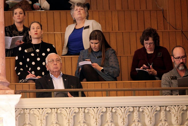 Three anti-abortion lobbyists sit in the second row of the main Kansas House gallery, monitoring its debates and votes, at the Statehouse in Topeka