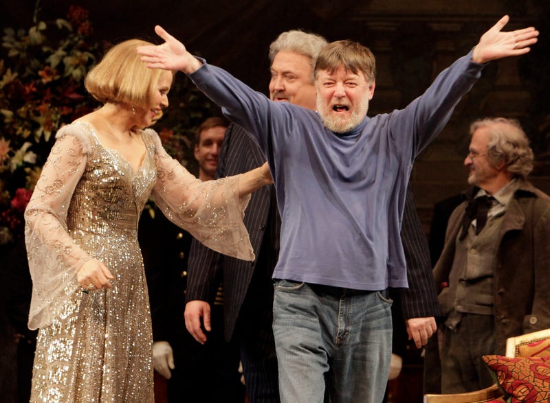 Conductor Andrew Davis, right, raises his arms as he takes a bow, accompanied by Renee Fleming, and Peter Rose, center, during the final dress rehearsal of Richard Strauss's "Capriccio" in the Metropolitan Opera at New York's Lincoln Center, March 25, 2011. Davis, the acclaimed British conductor who was music director of the Lyric Opera of Chicago and orchestras on three continents, has died, Saturday, April 20, 2024. He was 80.