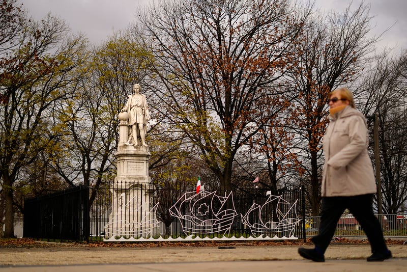 A person walks by the statue of Christopher Columbus at Marconi Plaza in Philadelphia, Monday, Dec. 12, 2022.