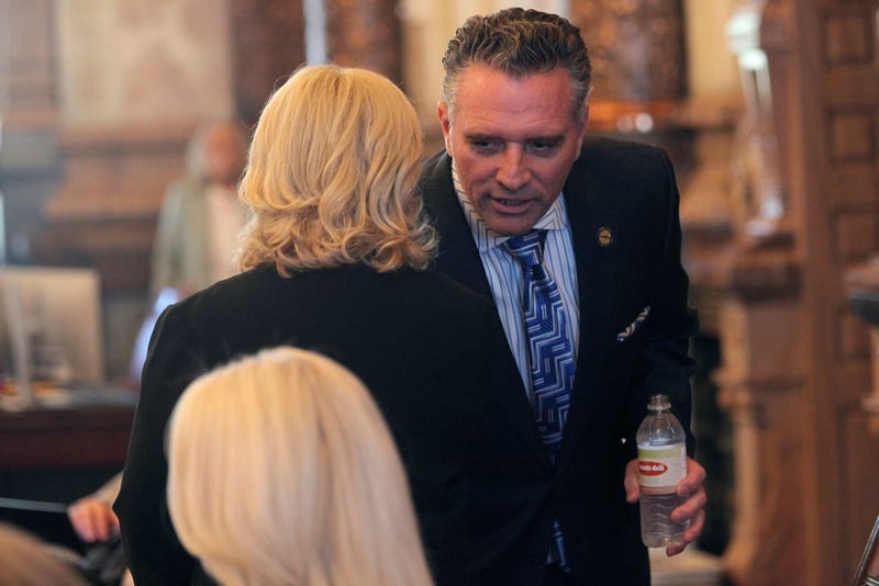 Kansas Senate President Ty Masterson, right, R-Andover, confers with Assessment and Taxation Committee Chair Caryn Tyson, left