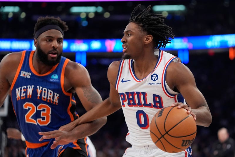 Philadelphia 76ers' Tyrese Maxey looks to pass as New York Knicks' Mitchell Robinson defends during the first half of Game 5 in an NBA basketball first-round playoff series on Tuesday.