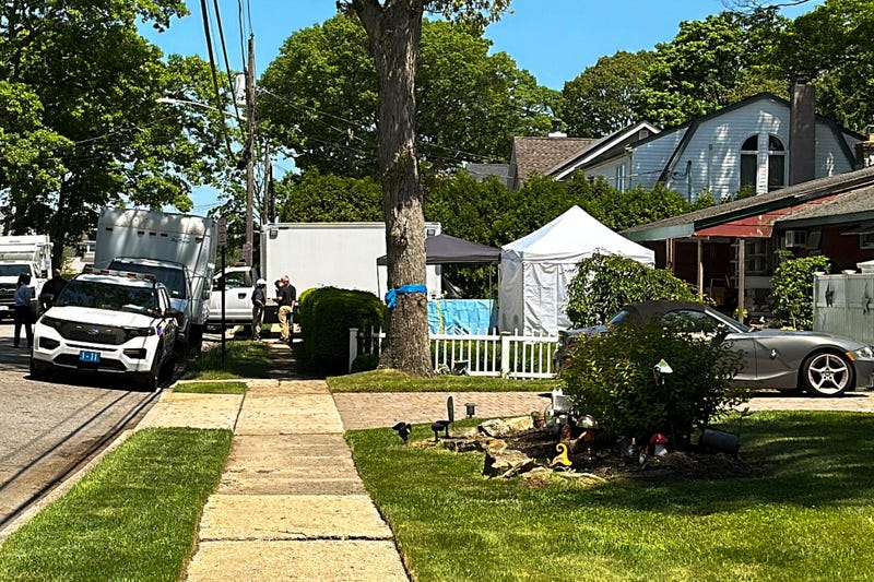 Suffolk County police stand outside the home of Rex Heuermann, Friday, May 24, 2024, in Massapequa Park