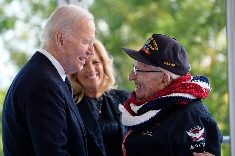 President Joe Biden and first lady Jill Biden, greet a World War II veteran during ceremonies to mark the 80th anniversary of D-Day, Thursday, June 6, 2024, in Normandy