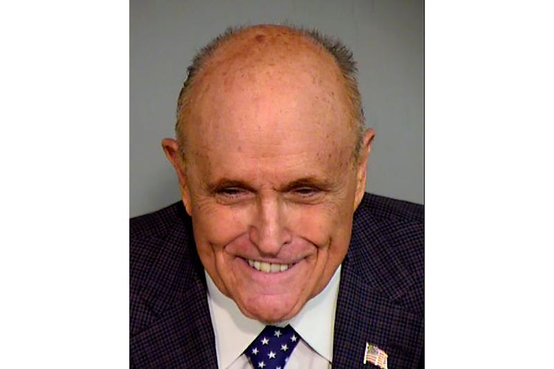 Giuliani was processed Monday in the criminal case over the effort to overturn Trump’s Arizona election loss to Joe Biden