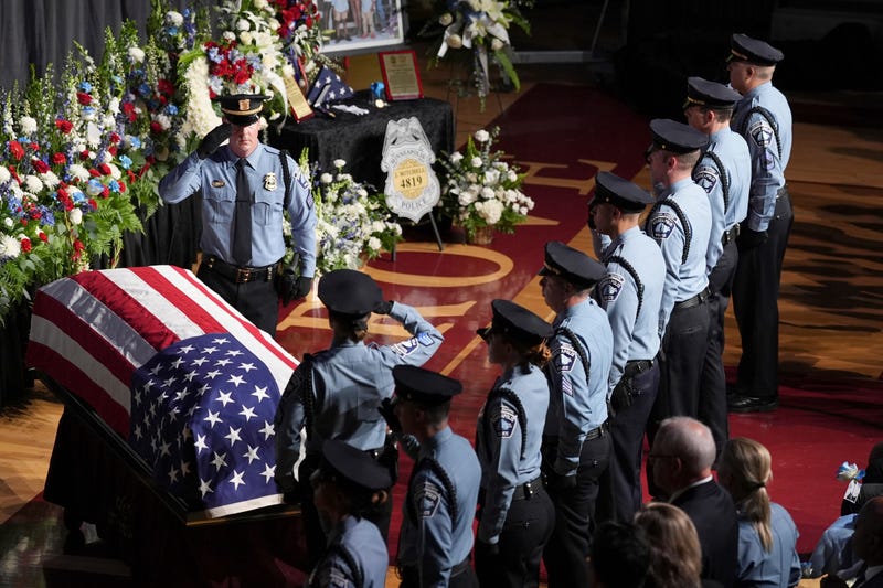 Law enforcement officers salute during a public memorial service for Minneapolis police Officer Jamal Mitchell who was shot and killed while responding to a shooting on May 30, 2024.