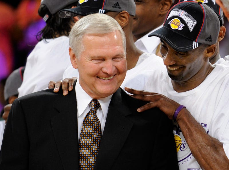 FILE -  Los Angeles Lakers' Kobe Bryant gives basketball great Jerry West a shoulder rub after the Lakers beat the San Antonio Spurs in Game 5 of the NBA Western Conference basketball finals in Los Angeles, May 29, 2008. Jerry West, who was selected to the Basketball Hall of Fame three times in a legendary career as a player and executive and whose silhouette is considered to be the basis of the NBA logo, died Wednesday morning, June 12, 2024, the Los Angeles Clippers announced. He was 86.
