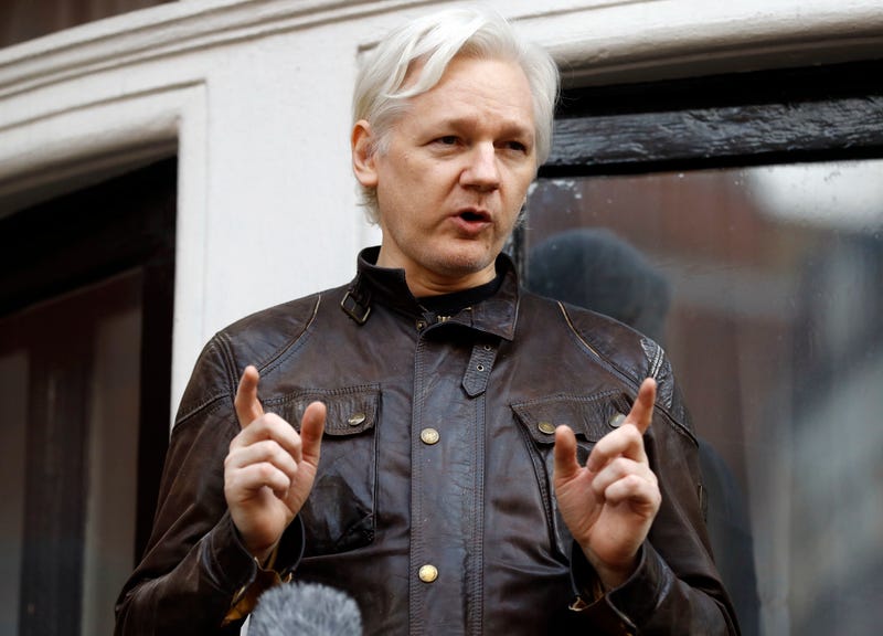 Julian Assange speaks to the media outside the Ecuadorian embassy in London, May 19, 2017. Assange will plead guilty to a felony charge in a deal with the U.S. Justice Department that will free him from prison and resolve a long-running legal saga over the publication of a trove of classified documents.