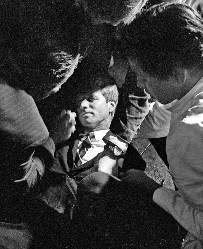In this June 5, 1968 file photo, Hotel busboy Juan Romero (right) comes to the aid of Senator Robert F. Kennedy, as he lies on the floor of the Ambassador hotel in Los Angeles moments after he was shot. Romero was a teenage busboy in June 1968 when Kennedy walked through the Ambassador Hotel kitchen after his victory in the California presidential primary and an assassin shot him in the head. He held the mortally wounded Kennedy as he lay on the ground, struggling to keep the senator's bleeding head from hitting the floor. 