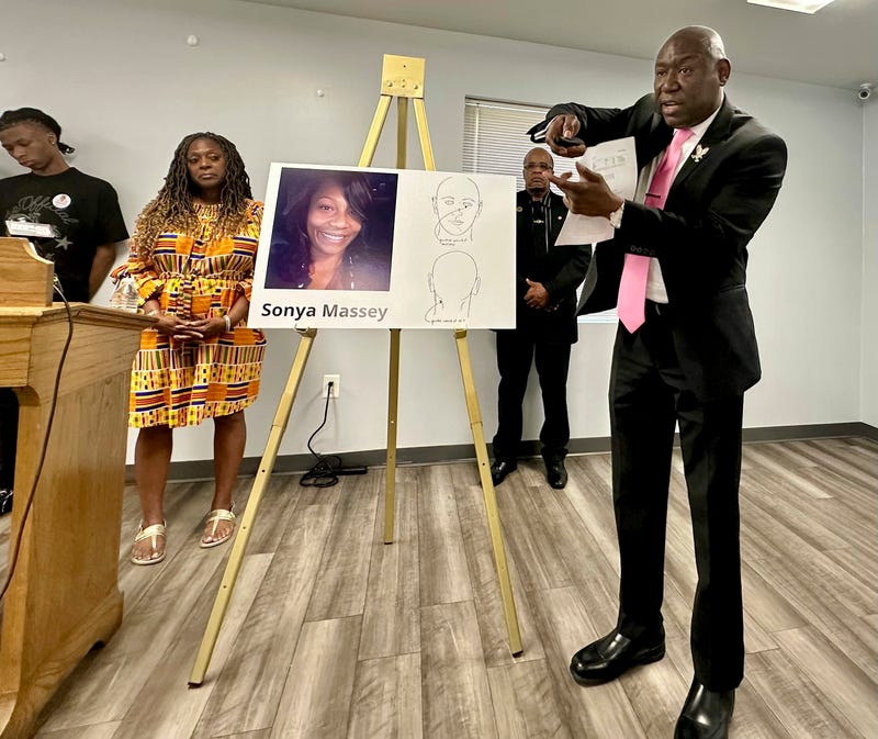 Ben Crump, the civil rights attorney representing the family of Sonya Massey, stands next to a diagram from the slain woman's autopsy on Friday, June 26, 2024, in Springfield, Ill., and gestures to show the downward angle in which Sangamon County Sheriff's Deputy Sean Grayson shot Massey in the face early on July 6. Massey had called 911 with suspicions of a prowler near her Springfield home. Grayson has pleaded not guilty to first-degree murder and other charges.