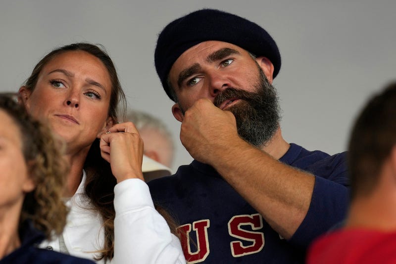 Recently retired Philadelphia Eagles lineman Jason Kelce and wife Kylie watch the women's field hockey match between the Argentina and United States, at the Yves-du-Manoir Stadium, at the 2024 Summer Olympics, Saturday, July 27, 2024, in Colombes, France. (AP Photo/Anjum Naveed)
