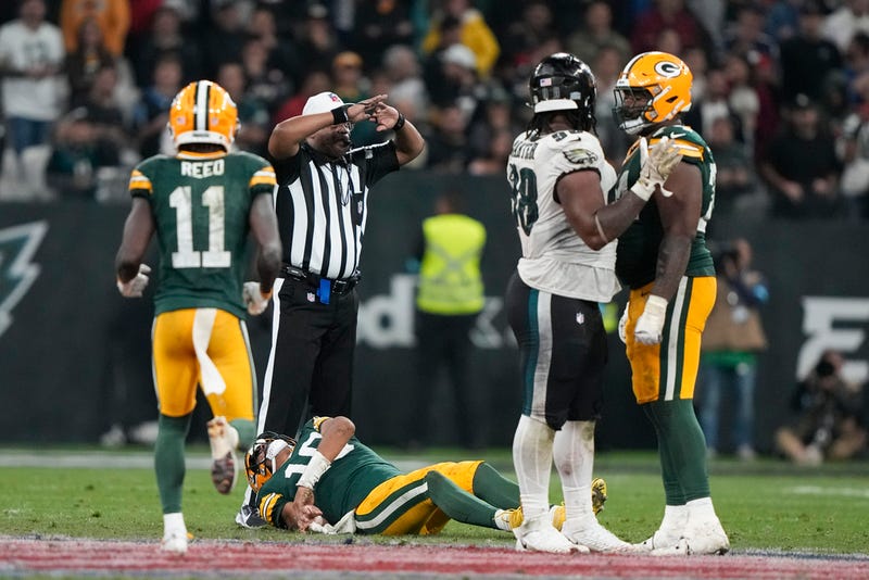 Green Bay Packers quarterback Jordan Love takes hit