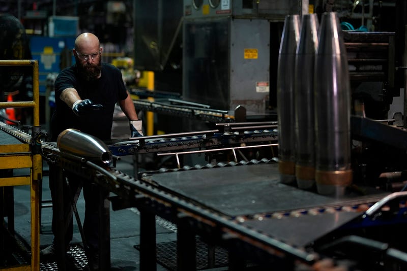 A steel worker moves a 155 mm M795 artillery projectile at the Scranton Army Ammunition Plant, Tuesday, Aug. 27, 2024, in Scranton, Pa.