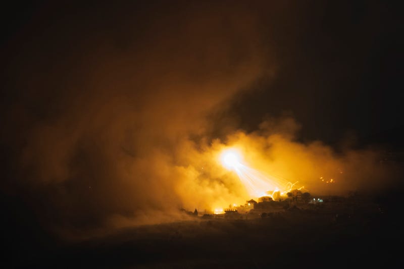 Israeli shelling hits an area in southern Lebanon as seen from northern Israel, early Tuesday, Oct. 1, 2024.