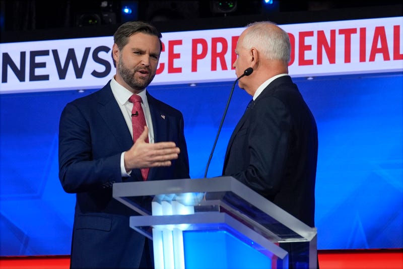 JD Vance talks with Tim Walz
