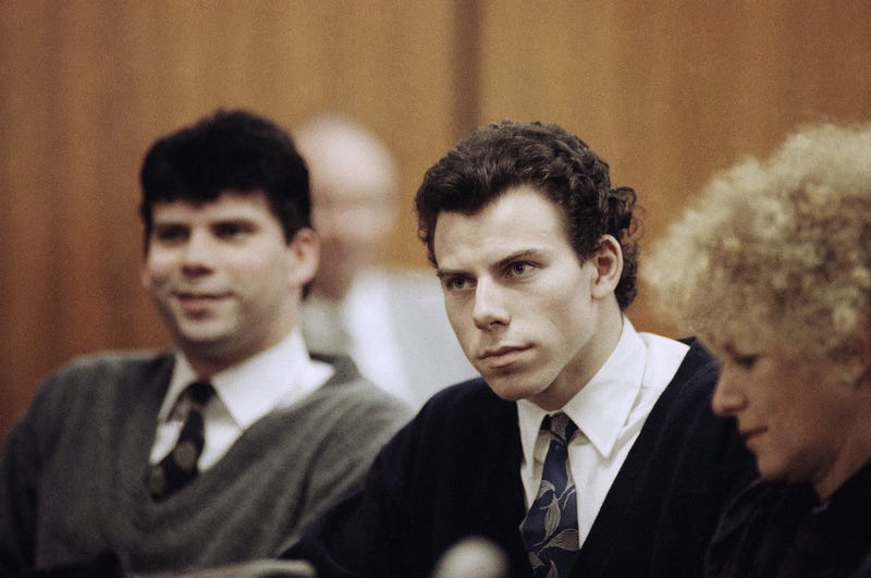 Lyle, left, and Erik Menendez sit with defense attorney Leslie Abramson, right, in Beverly Hills Municipal Court during a hearing, Nov. 26, 1990. 