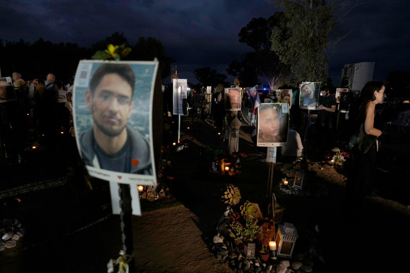 People visit the site of the Nova music festival, where hundreds of revelers were killed and abducted by Hamas and taken into Gaza, on the one-year anniversary of the attack, near Kibbutz Reim, southern Israel, Monday, Oct. 7, 2024.