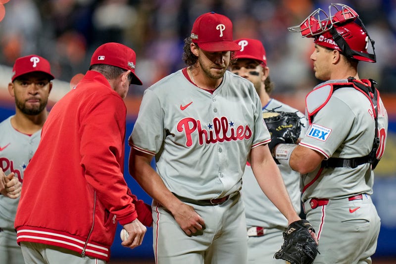Philadelphia Phillies pitcher Aaron Nola is relieved by manager Rob Thomson during the sixth inning of Game 3 of the National League baseball playoff series against the New York Mets, Tuesday, Oct. 8, 2024, in New York.