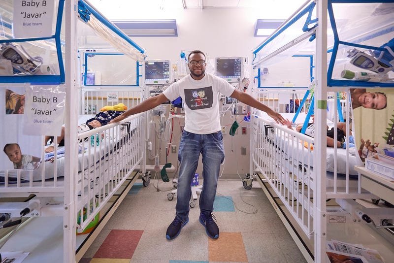 This undated photo provided by the Children’s Hospital of Philadelphia in October 2024 shows Tim Ruffin with his previously conjoined twins, after eparation surgery at the Children’s Hospital of Philadelphia.