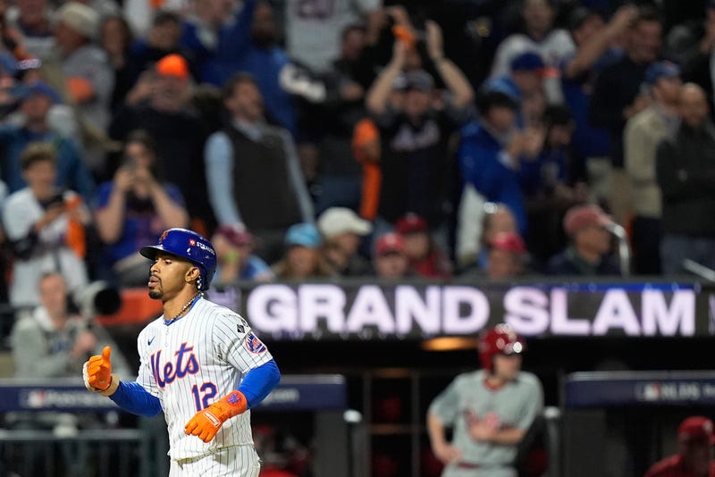 New York Mets' Francisco Lindor rounds the bases after hitting a grand slam home run against the Philadelphia Phillies during the sixth inning of Game 4 of the National League baseball playoff series, Wednesday, Oct. 9, 2024, in New York.