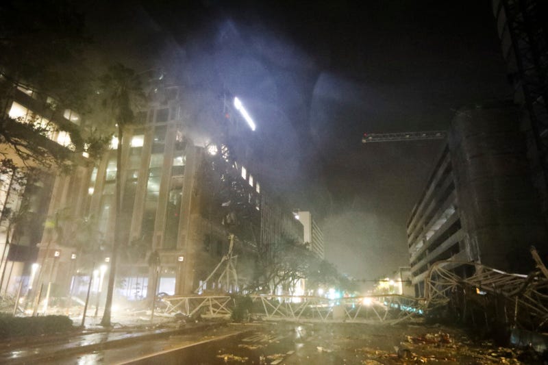 A crane is seen across 1st Avenue South near the Tampa Bay Times offices in St. Petersburg, Florida, Thursday, Oct. 10, 2024, as Hurricane Milton's strong winds tore through the area.