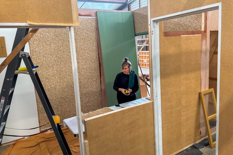 Wallpaper is being prepared for an exact replica of the secret annex which will travel to New York for an exhibit, in the village of Erp, southern Netherlands, Thursday, Oct. 10, 2024