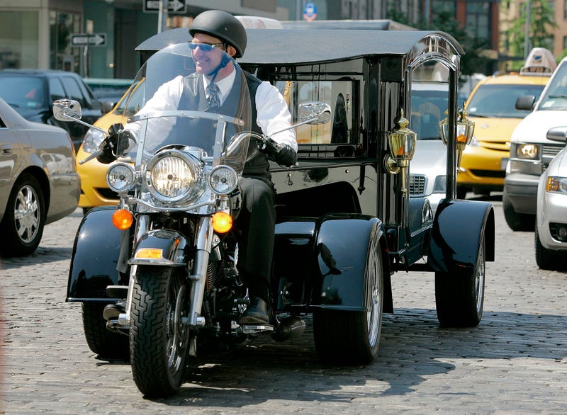 Peter Moloney, of Moloney Family Funeral Homes in Lake Ronkonkoma, N.Y., rides his Harley Davidson hearse from the Tombstone Hearse Co. of Alum Bank, Pa., in New York, May 24, 2007