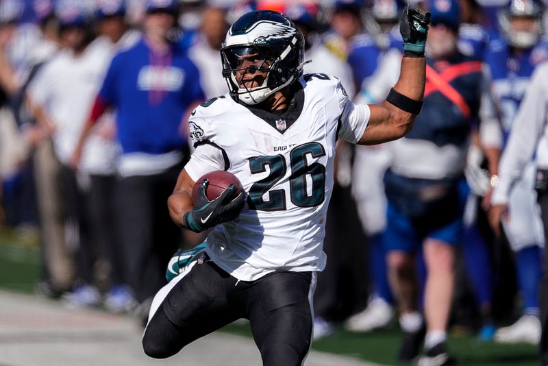 Philadelphia Eagles running back Saquon Barkley carries the ball for a first down against the New York Giants during the second quarter of an NFL football game, Sunday, Oct. 20, 2024, in East Rutherford, N.J.