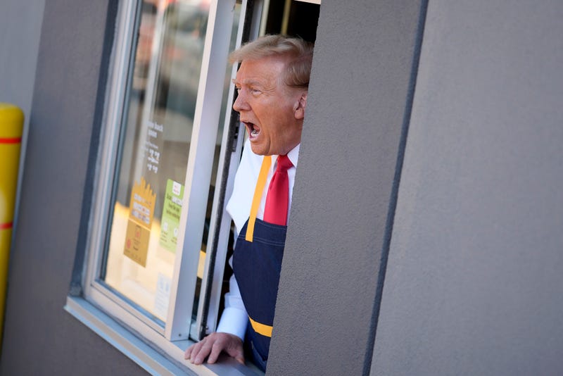 Republican presidential nominee former President Donald Trump speaks while standing at a drive-thru window during a campaign stop at a McDonald's, Sunday, Oct. 20, 2024, in Feasterville-Trevose, Pa.
