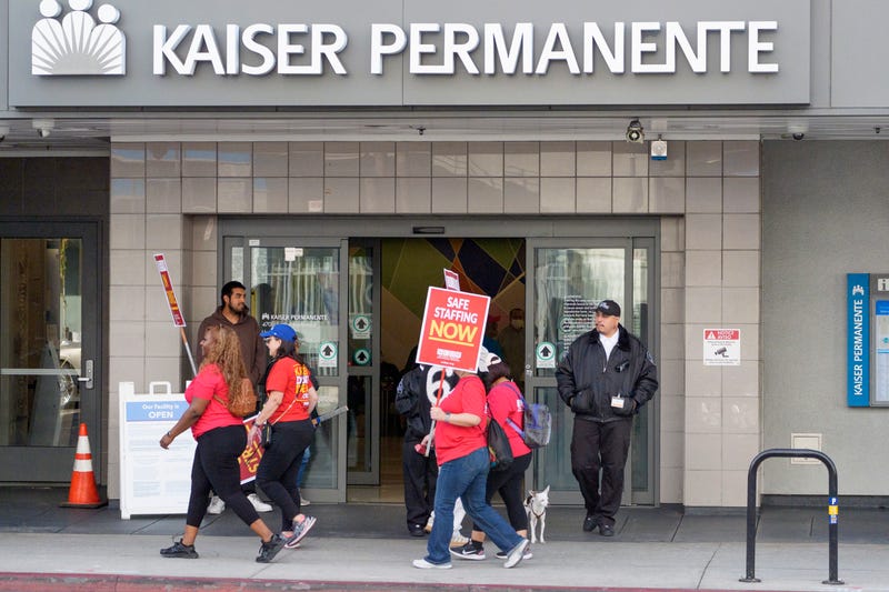 Mental health workers strike outside a Kaiser Permanente facility in Los Angeles Monday, Oct. 21, 2024.