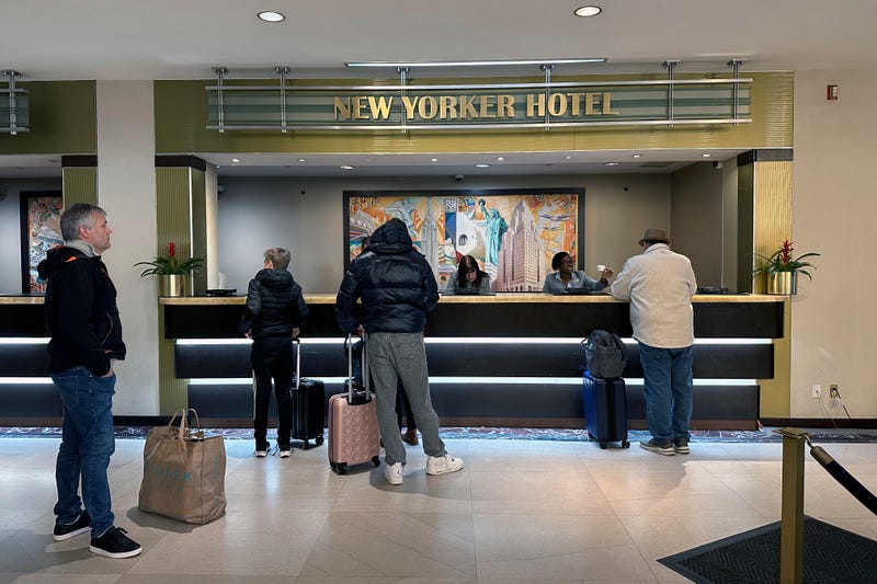 People check into the New Yorker Hotel in New York on Sunday, Feb. 18, 2024.