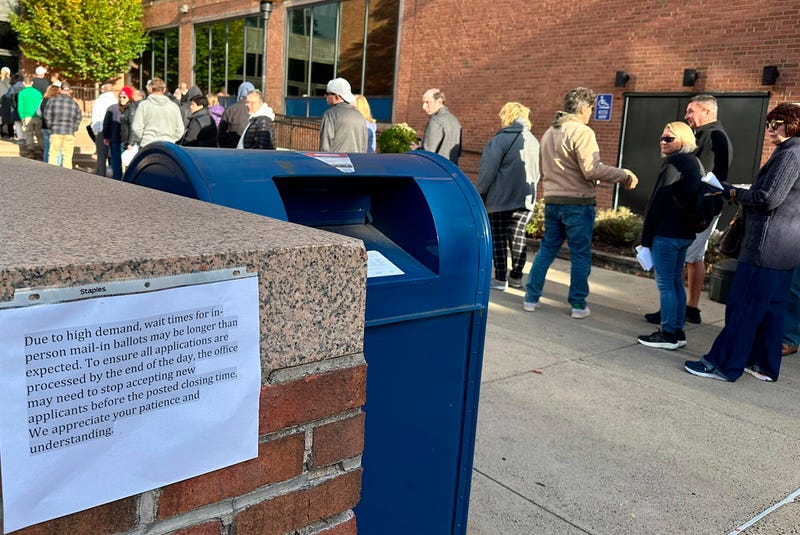 People wait in line outside the Bucks County government building in Doylestown to apply for an on-demand mail-in ballot on Tuesday, the last day to request one.