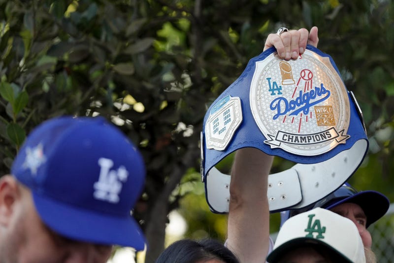 fan holding  dodgers championship belt