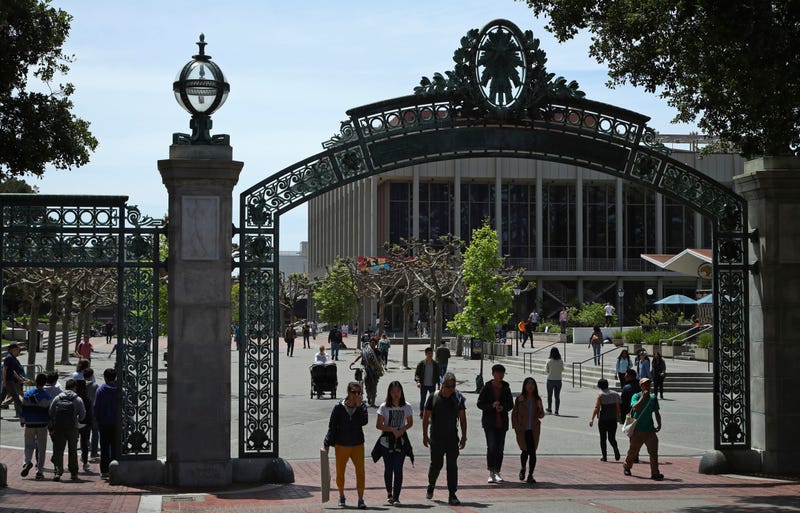 FILE - Students walk past Sather Gate on the University of California at Berkeley campus in Berkeley, Calif., May 10, 2018.