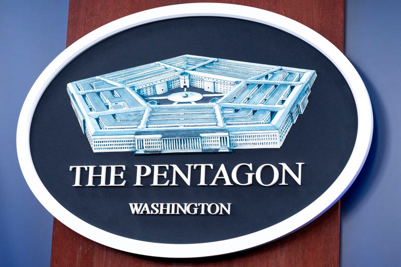 The Department of Defense logo is seen on the wall in the Press Briefing room at the Pentagon on Tuesday, Oct. 29, 2024 in Washington. (AP Photo/Kevin Wolf