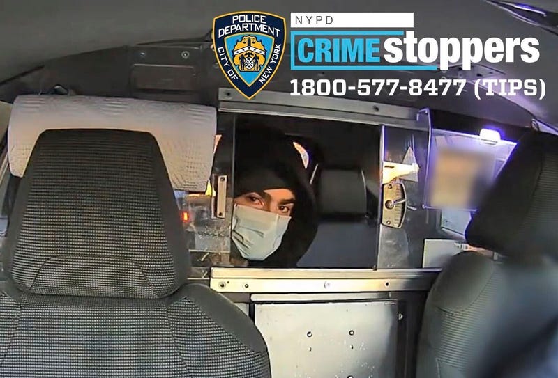 The suspect is seen in a taxi cab before the shooting
