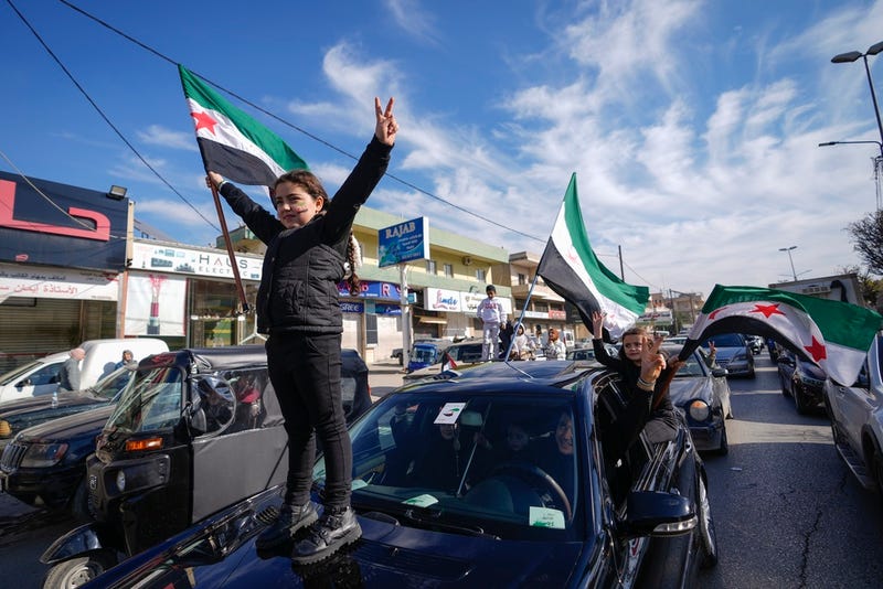 Syrians celebrate the fall of Bashar Assad's government