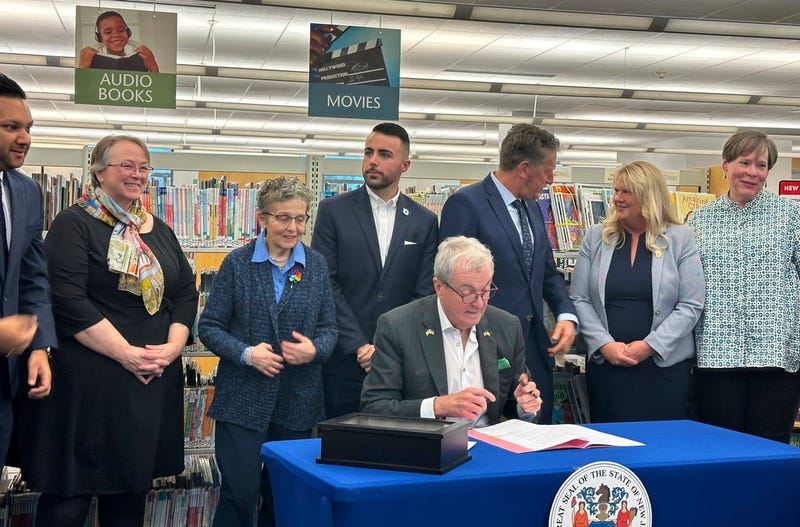 New Jersey Gov. Phil Murphy at the Princeton Public Library on Monday, Dec. 9, 2024, signs legislation aimed at barring public libraries and schools from banning books.
