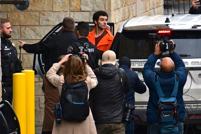 Suspect Luigi Mangione is taken into the Blair County Courthouse on Tuesday, in Hollidaysburg, Pa.