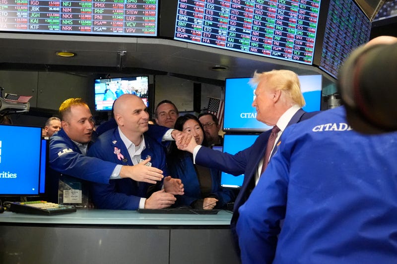 President-elect Donald Trump is greeted by traders, as he walks the floor of the New York Stock Exchange, Thursday, Dec. 12, 2024, in New York