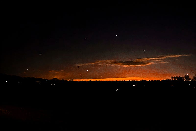 This photo provided by Trisha Bushey shows the evening sky and points of light near in Lebanon Township, N.J., on Thursday, Dec. 5, 2024
