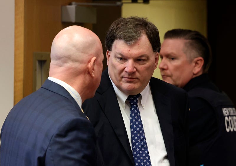 Rex A. Heuermann speaks with his lawyer Michael Brown during a court hearing where he was charged in the killing of Valerie Mack, inside Supreme Court Justice Timothy Mazzei's courtroom at Suffolk County Court in Riverhead, N.Y. on Tuesday, Dec. 17, 2024