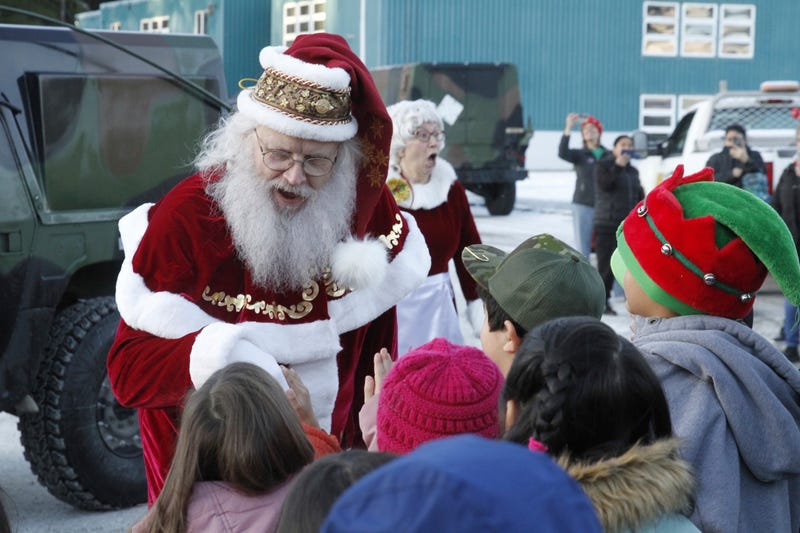 Santa and Mrs. Claus use military transports to bring Christmas to an Alaska Native village